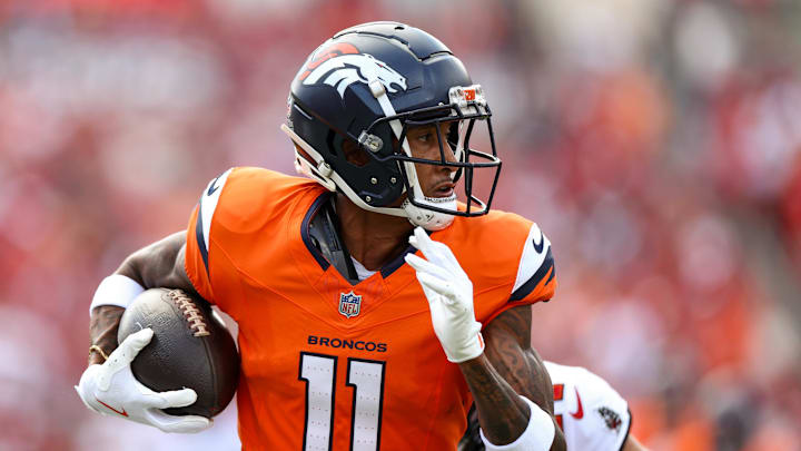 Sep 22, 2024; Tampa, Florida, USA; Denver Broncos wide receiver Josh Reynolds (11) makes a catch against the Tampa Bay Buccaneers in the first quarter at Raymond James Stadium. Mandatory Credit: Nathan Ray Seebeck-Imagn Images
