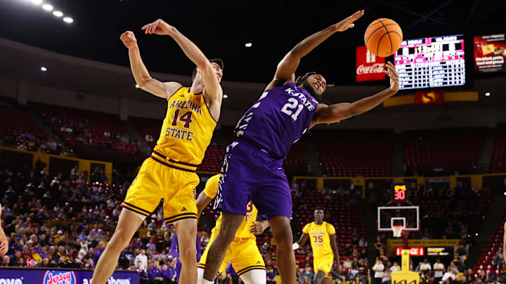 Kansas State forward Khamari McGriff grabs a rebound against Arizona State forward Andrija Grbovic in the first half at Desert Financial Arena. 