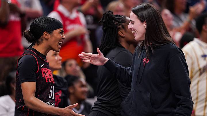 Indiana Fever guard Caitlin Clark (22) high-fives Indiana Fever guard Sydney Colson (51) on Thursday, July 24, 2025, during the game at Gainbridge Fieldhouse in Indianapolis. Indiana Fever guard Caitlin Clark (22) high-fives Indiana Fever guard Sydney Colson (51) on Thursday, July 24, 2025, during the game at Gainbridge Fieldhouse in Indianapolis.