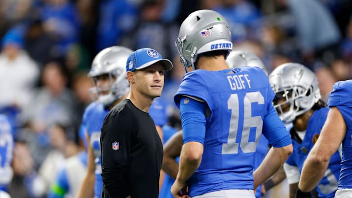 Ben Johnson chats with Jared Goff during the Lions' game against the Packers.