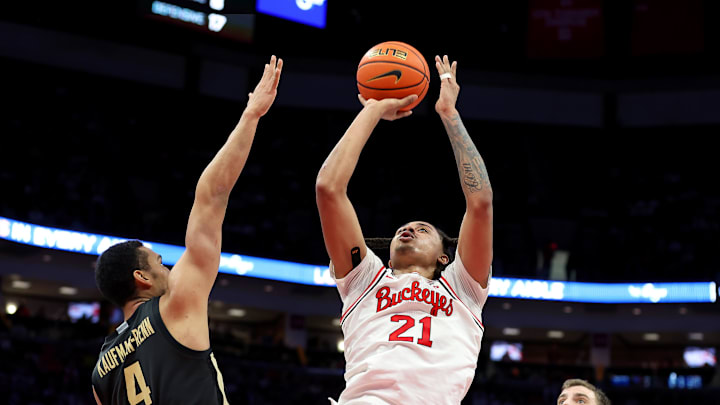 Mar 1, 2026; Columbus, Ohio, USA; Ohio State Buckeyes forward Devin Royal (21) shoots the ball as Purdue Boilermakers forward Trey Kaufman-Renn (4) defends during the second half at Value City Arena. Mandatory Credit: Joseph Maiorana-Imagn Images Mar 1, 2026; Columbus, Ohio, USA; Ohio State Buckeyes forward Devin Royal (21) shoots the ball as Purdue Boilermakers forward Trey Kaufman-Renn (4) defends during the second half at Value City Arena. Mandatory Credit: Joseph Maiorana-Imagn Images