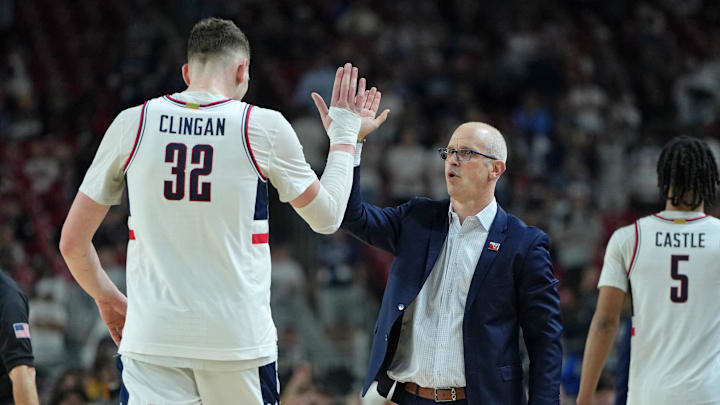 Apr 6, 2024; Glendale, AZ, USA; Connecticut Huskies head coach Dan Hurley high fives center Donovan Clingan (32) as he exits the game against the Alabama Crimson Tide during the second half in the semifinals of the men's Final Four of the 2024 NCAA Tournament at State Farm Stadium. Mandatory Credit: Bob Donnan-USA TODAY Sports