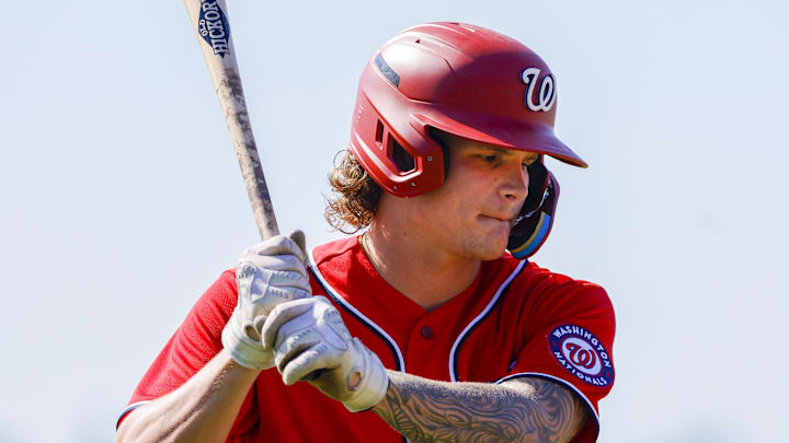 Feb 20, 2023; West Palm Beach, FL, USA; Washington Nationals infielder Brady House (9) practices his swing during a spring training workout at The Ballpark of the Palm Beaches.