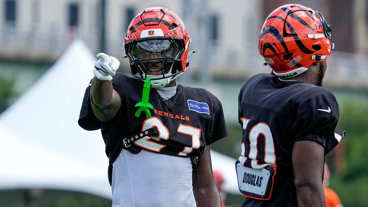 Cincinnati Bengals safety Jordan Battle (27) chats with young fans during practice at the Paycor Stadium practice facility in downtown Cincinnati on Monday, Aug. 3, 2026. Cincinnati Bengals safety Jordan Battle (27) chats with young fans during practice at the Paycor Stadium practice facility in downtown Cincinnati on Monday, Aug. 3, 2026.