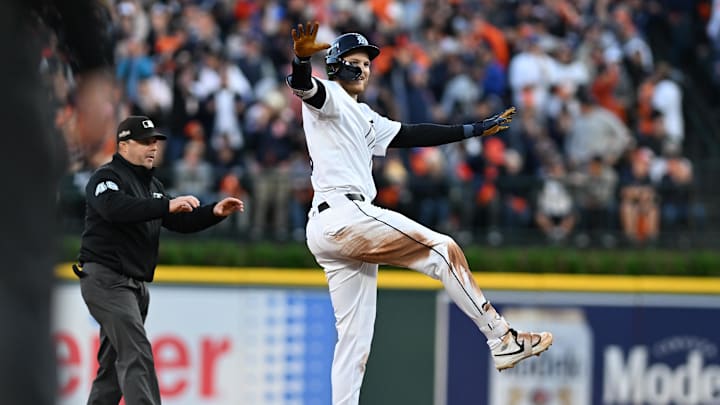 Oct 10, 2024; Detroit, Michigan, USA; Detroit Tigers outfielder Parker Meadows (22) celebrates after sliding safely in to second base in the first inning against the Cleveland Guardians during game four of the ALDS for the 2024 MLB Playoffs at Comerica Park.