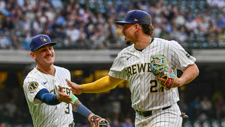 Sep 28, 2024; Milwaukee, Wisconsin, USA; Milwaukee Brewers shortstop Willy Adames (27) reacts with third baseman Joey Ortiz (3) after making a play in the first inning against the New York Mets at American Family Field. Mandatory Credit: Benny Sieu-Imagn Images Sep 28, 2024; Milwaukee, Wisconsin, USA; Milwaukee Brewers shortstop Willy Adames (27) reacts with third baseman Joey Ortiz (3) after making a play in the first inning against the New York Mets at American Family Field. Mandatory Credit: Benny Sieu-Imagn Images
