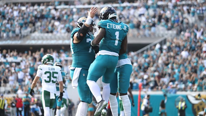 Dec 14, 2025; Jacksonville, Florida, USA; Jacksonville Jaguars running back Travis Etienne Jr. (1) reacts after scoring a touchdown during the second quarter against the New York Jets at EverBank Stadium. Mandatory Credit: Morgan Tencza-Imagn Images