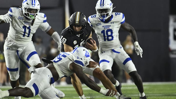 Sep 20, 2025; Nashville, Tennessee, USA; Georgia State Panthers linebacker Josiah Robinson (25) tackles Vanderbilt Commodores quarterback Blaze Berlowitz (19) during the second half at FirstBank Stadium. Mandatory Credit: Steve Roberts-Imagn Images Sep 20, 2025; Nashville, Tennessee, USA; Georgia State Panthers linebacker Josiah Robinson (25) tackles Vanderbilt Commodores quarterback Blaze Berlowitz (19) during the second half at FirstBank Stadium. Mandatory Credit: Steve Roberts-Imagn Images