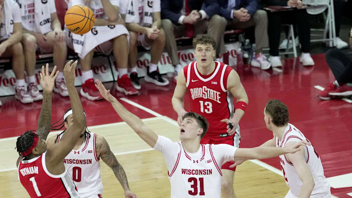 Ohio State forward Amare Bynum (1) scores on Wisconsin forward Nolan Winter (31) during the first half of their game Saturday, January 31, 2026 at the Kohl Center in Madison, Wisconsin.
