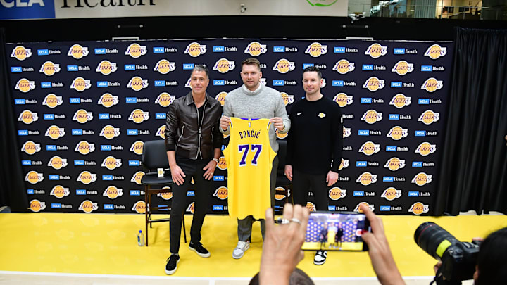 Feb 4, 2025; El Segundo, CA, USA; Los Angeles Lakers guard Luka Doncic, vice president of basketball operations Rob Pelinka and head coach JJ Redick pose for photos at UCLA Health Training Center. Mandatory Credit: Gary A. Vasquez-Imagn Images