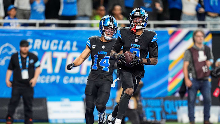 Detroit Lions wide receiver Jameson Williams (9) celebrates with wide receiver Amon-Ra St. Brown (14) as he scores 70-yards touchdown against Seattle Seahawks during the second half at Ford Field in Detroit on Monday, Sept. 30, 2024.