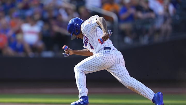Sep 18, 2022; New York City, New York, USA; New York Mets center fielder Terrance Gore (4) advances to third base on an errant throw to second base against the Pittsburgh Pirates during the eighth inning at Citi Field. Mandatory Credit: Gregory Fisher-Imagn Images