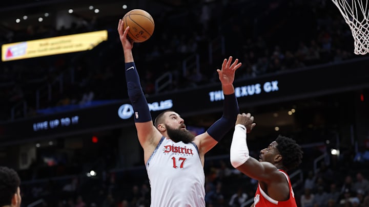 Dec 8, 2024; Washington, District of Columbia, USA; Washington Wizards center Jonas Valanciunas (17) shoots the ball over Memphis Grizzlies forward Jaren Jackson Jr. (13) in the second quarter at Capital One Arena. Mandatory Credit: Geoff Burke-Imagn Images