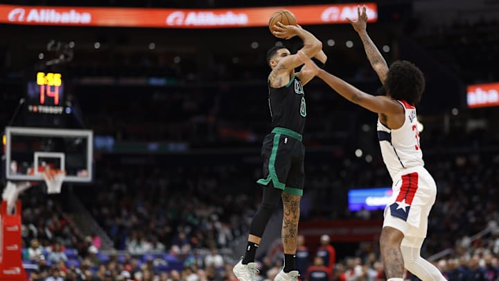 Oct 24, 2024; Washington, District of Columbia, USA; Boston Celtics forward Jayson Tatum (0) shoots the ball over Washington Wizards forward Marvin Bagley III (35) in the first half at Capital One Arena. Mandatory Credit: Geoff Burke-Imagn Images