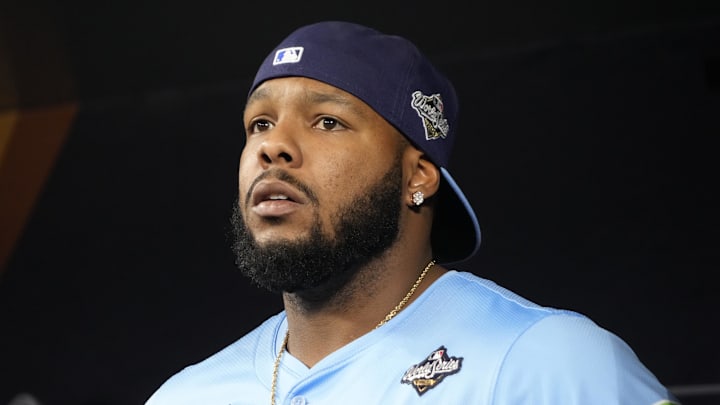 Oct 31, 2025; Toronto, Ontario, CAN; Toronto Blue Jays first baseman Vladimir Guerrero Jr. (27) looks on from the dugout before game six of the 2025 MLB World Series against the Los Angeles Dodgers at Rogers Centre. Mandatory Credit: John E. Sokolowski-Imagn Images Oct 31, 2025; Toronto, Ontario, CAN; Toronto Blue Jays first baseman Vladimir Guerrero Jr. (27) looks on from the dugout before game six of the 2025 MLB World Series against the Los Angeles Dodgers at Rogers Centre. Mandatory Credit: John E. Sokolowski-Imagn Images