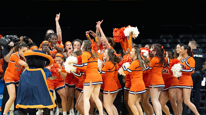 The Virginia Cavaliers women’s basketball team celebrates after upsetting the Iowa Hawkeyes March 23, 2026 during a Round of 32 NCAA March Madness game at Carver-Hawkeye Arena in Iowa City, Iowa. The Virginia Cavaliers women’s basketball team celebrates after upsetting the Iowa Hawkeyes March 23, 2026 during a Round of 32 NCAA March Madness game at Carver-Hawkeye Arena in Iowa City, Iowa.