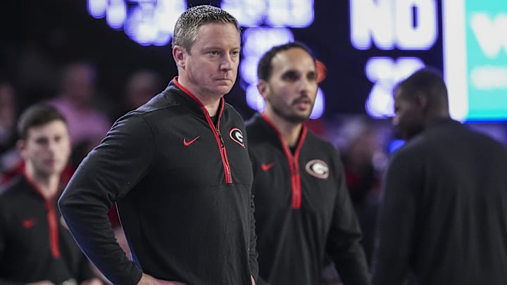 Dec 3, 2024; Athens, Georgia, USA; Georgia Bulldogs head coach Mike White on the bench during the game against the Notre Dame Fighting Irish during the first half at Stegeman Coliseum. Mandatory Credit: Dale Zanine-Imagn Images