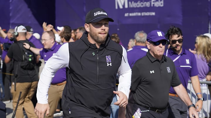 Oct 5, 2024; Evanston, Illinois, USA; Northwestern Wildcats head coach David Braun takes the field against the Indiana Hoosiers at Lanny and Sharon Martin Stadium. Mandatory Credit: David Banks-Imagn Images
