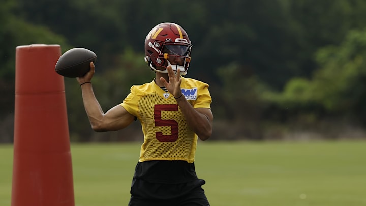 Washington Commanders quarterback Jayden Daniels passes a ball during practice on day one of training camp. Washington Commanders quarterback Jayden Daniels passes a ball during practice on day one of training camp.