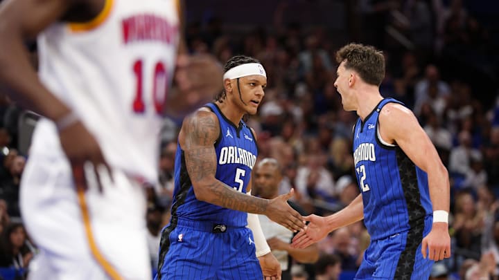 Feb 27, 2025; Orlando, Florida, USA; Orlando Magic forward Paolo Banchero (5) and forward Franz Wagner (22) celebrate after a basket against the Golden State Warriors in the second quarter at Kia Center. Mandatory Credit: Nathan Ray Seebeck-Imagn Images