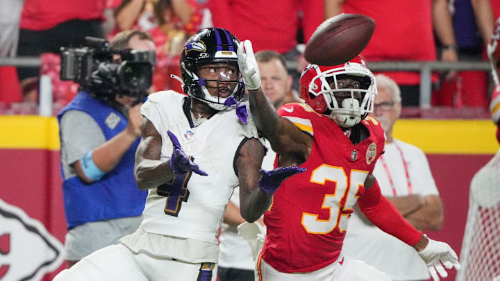 Sep 5, 2024; Kansas City, Missouri, USA; Kansas City Chiefs cornerback Jaylen Watson (35) breaks up a pass intended for Baltimore Ravens wide receiver Zay Flowers (4) during the second half at GEHA Field at Arrowhead Stadium. Mandatory Credit: Denny Medley-Imagn Images