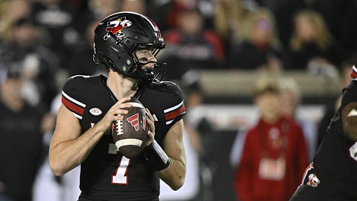 Nov 14, 2025; Louisville, Kentucky, USA;  Louisville Cardinals quarterback Miller Moss (7) looks to pass against the Clemson Tigers during the first half at L&N Federal Credit Union Stadium. Mandatory Credit: Jamie Rhodes-Imagn Images