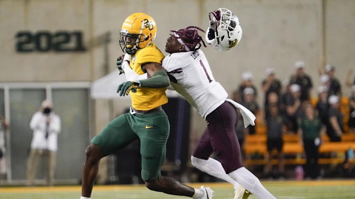Sep 2, 2023; Waco, Texas, USA; Baylor Bears wide receiver Hal Presley (16) is tackled by Texas State Bobcats cornerback Joshua Eaton (1) after a reception during the second half at McLane Stadium. Mandatory Credit: Raymond Carlin III-Imagn Images