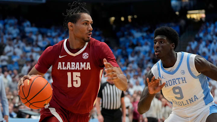 Dec 4, 2024; Chapel Hill, North Carolina, USA; Alabama Crimson Tide forward Jarin Stevenson (15) with the ball as North Carolina Tar Heels guard Drake Powell (9) defends in the first half at Dean E. Smith Center. Mandatory Credit: Bob Donnan-Imagn Images Dec 4, 2024; Chapel Hill, North Carolina, USA; Alabama Crimson Tide forward Jarin Stevenson (15) with the ball as North Carolina Tar Heels guard Drake Powell (9) defends in the first half at Dean E. Smith Center. Mandatory Credit: Bob Donnan-Imagn Images