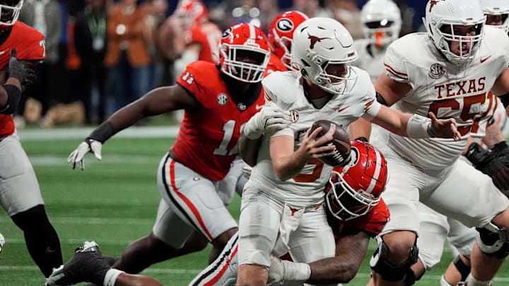 Georgia defensive lineman Mykel Williams (13) sacks Texas quarterback Quinn Ewers (3) during the second half of the SEC championship game against Texas in Atlanta, on Saturday, Dec. 7, 2024.