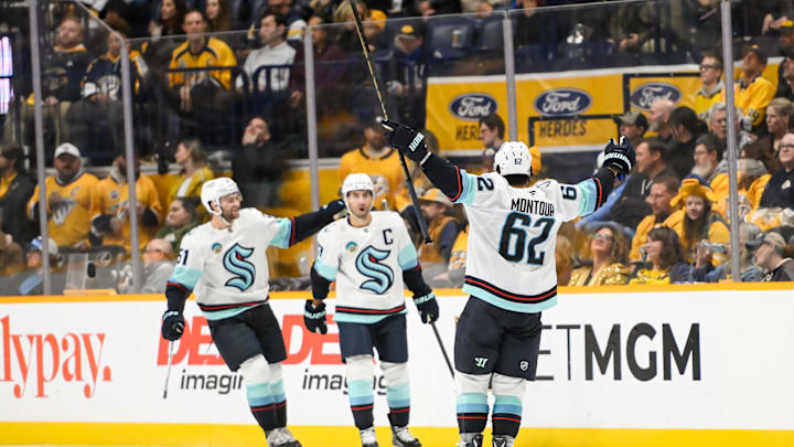 Oct 15, 2024; Nashville, Tennessee, USA; Seattle Kraken right wing Jordan Eberle (7) celebrates his goal with his teammates against the Nashville Predators  during the third period at Bridgestone Arena. Mandatory Credit: Steve Roberts-Imagn Images