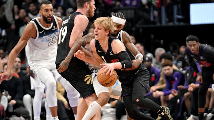 Nov 21, 2024; Toronto, Ontario, CAN; Toronto Raptors forward Gradey Dick (1) dribbles the ball past Minnesota Timberwolves forward Josh Minott (8) in the first half at Scotiabank Arena. Mandatory Credit: Dan Hamilton-Imagn Images Nov 21, 2024; Toronto, Ontario, CAN; Toronto Raptors forward Gradey Dick (1) dribbles the ball past Minnesota Timberwolves forward Josh Minott (8) in the first half at Scotiabank Arena. Mandatory Credit: Dan Hamilton-Imagn Images