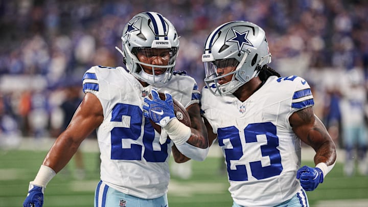 Dallas Cowboys running backs Tony Pollard and Rico Dowdle warm up before a game against the New York Giants at MetLife Stadium. 