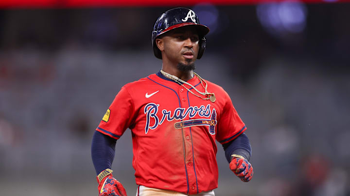 Atlanta Braves second baseman Ozzie Albies (1) hits a triple against the Seattle Mariners in the eighth inning at Truist Park. 