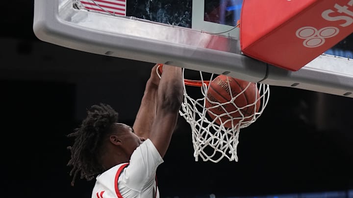 Sun Prairie East's Chris Davis Jr. (4) dunks during the Deer District Prep Showcase game against Stevens Point at Fiserv Forum in Milwaukee, WI. on Saturday, Feb. 8, 2025. 