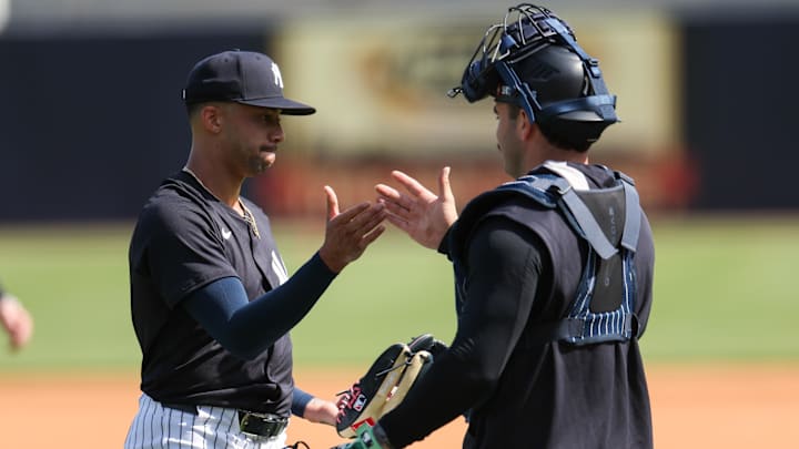 Feb 14, 2025; Tampa, FL, USA; New York Yankees relief pitcher Devin Williams (38) and catcher Austin Wells (28) participate in spring training workouts at George M. Steinbrenner Field.