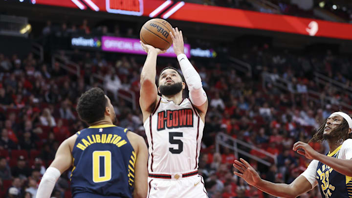 Nov 20, 2024; Houston, Texas, USA; Houston Rockets guard Fred VanVleet (5) shoots the ball as Indiana Pacers guard Tyrese Haliburton (0) defends during the second quarter at Toyota Center. Mandatory Credit: Troy Taormina-Imagn Images