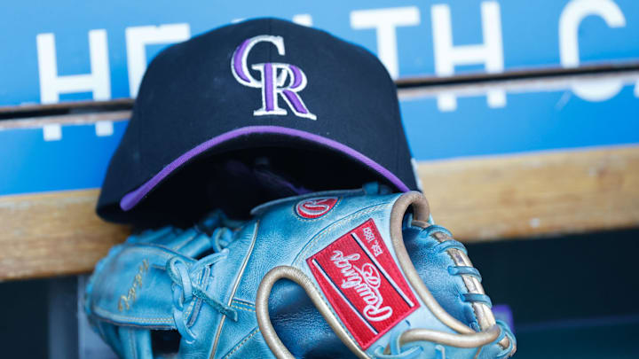 Colorado Rockies cap and glove in the dugout during the game against the Detroit Tigers at Comerica Park.