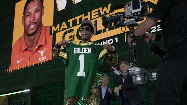 Receiver Matthew Golden of Texas poses after being selected with the 23rd pick by the Green Bay Packers.