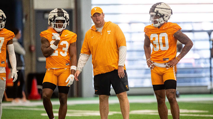 Tennessee head coach Josh Heupel with defensive backs Boo Carter (23) and Jakobe Thomas (30) during