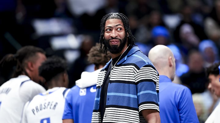Feb 27, 2025; Dallas, Texas, USA;  Dallas Mavericks forward Anthony Davis laughs during a timeout against the Charlotte Hornets during the first half at American Airlines Center. Mandatory Credit: Kevin Jairaj-Imagn Images