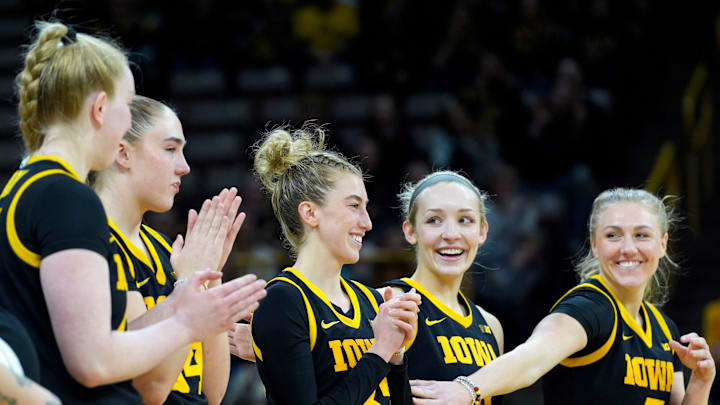 Iowa seniors Addison O'Grady (44), AJ Ediger (34), Lucy Olsen (33), Kylie Feuerbach (4) and Sydney Affolter (3) react during senior recognition after playing Wisconsin Sunday, March 2, 2025 at Carver-Hawkeye Arena in Iowa City, Iowa.