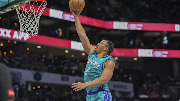Apr 1, 2024; Charlotte, North Carolina, USA; Charlotte Hornets forward Grant Williams (2) goes to the basket against the Boston Celtics during the second half at Spectrum Center. Mandatory Credit: Jim Dedmon-Imagn Images