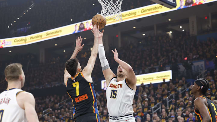May 5, 2025; Oklahoma City, Oklahoma, USA; Denver Nuggets center Nikola Jokic (15) shoots against Oklahoma City Thunder forward Chet Holmgren (7) during the first quarter during game one of the second round for the 2025 NBA Playoffs at Paycom Center. Mandatory Credit: Alonzo Adams-Imagn Images