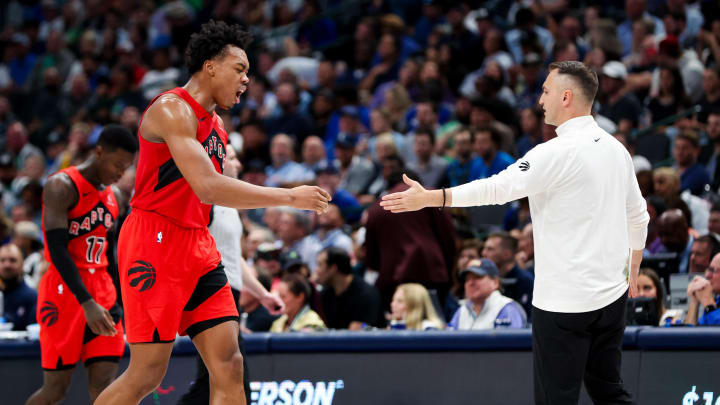 Nov 8, 2023; Dallas, Texas, USA;  Toronto Raptors forward Scottie Barnes (4) celebrates with Toronto Raptors head coach Darko Rajakovic during the second half against the Dallas Mavericks at American Airlines Center. Mandatory Credit: Kevin Jairaj-USA TODAY Sports