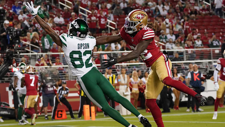 Sep 9, 2024; Santa Clara, California, USA; New York Jets wide receiver Xavier Gipson (82) leaps for a pass while being defended by San Francisco 49ers cornerback Isaac Yiadom (22) in the fourth quarter at Levi's Stadium. Mandatory Credit: David Gonzales-Imagn Images