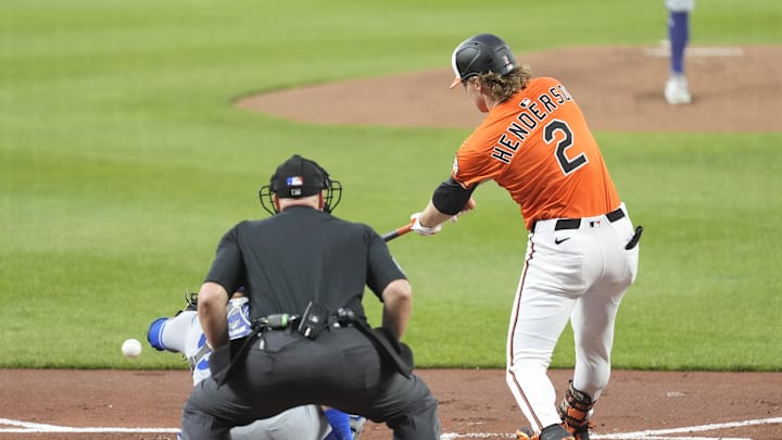 Baltimore Orioles shortstop Gunnar Henderson (2) hits a single against the Kansas City Royals during the first inning at Oriole Park at Camden Yards on May 3.