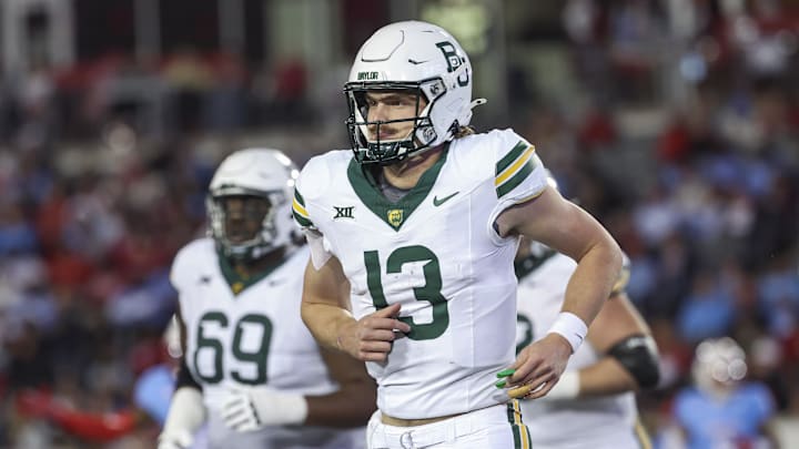 Nov 23, 2024; Houston, Texas, USA; Baylor Bears quarterback Sawyer Robertson (13) jogs off the field during the fourth quarter against the Houston Cougars at TDECU Stadium. Mandatory Credit: Troy Taormina-Imagn Images