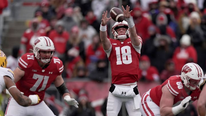 Wisconsin quarterback Braedyn Locke (18) grabs a high snap during the first quarter of their game at Camp Randall Stadium Friday, November 29, 2024 in Madison, Wisconsin. Minnesota beat Wisconsin 24-7. Wisconsin quarterback Braedyn Locke (18) grabs a high snap during the first quarter of their game at Camp Randall Stadium Friday, November 29, 2024 in Madison, Wisconsin. Minnesota beat Wisconsin 24-7.