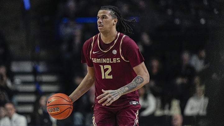 Feb 12, 2025; Winston-Salem, North Carolina, USA;  Florida State Seminoles forward Malique Ewin (12) brings the ball up court against the Wake Forest Demon Deacons during the second half at Lawrence Joel Veterans Memorial Coliseum. Mandatory Credit: Jim Dedmon-Imagn Images