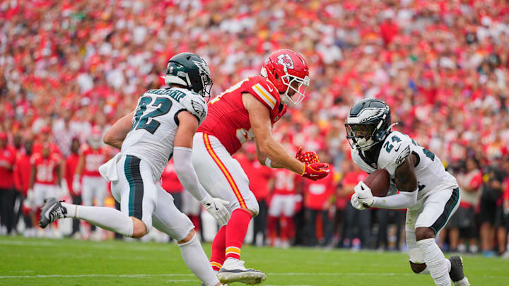 Sep 14, 2025; Kansas City, Missouri, USA; Philadelphia Eagles safety Andrew Mukuba (24) intercepts a pass intended for Kansas City Chiefs tight end Travis Kelce (87) during the fourth quarter of the game at GEHA Field at Arrowhead Stadium. Mandatory Credit: Jay Biggerstaff-Imagn Images
